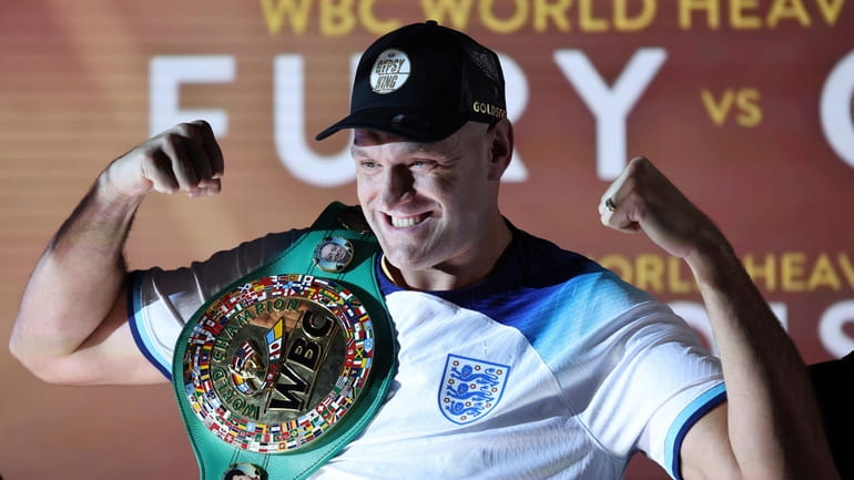 WBC heavyweight boxing champion Tyson Fury poses with his championship...