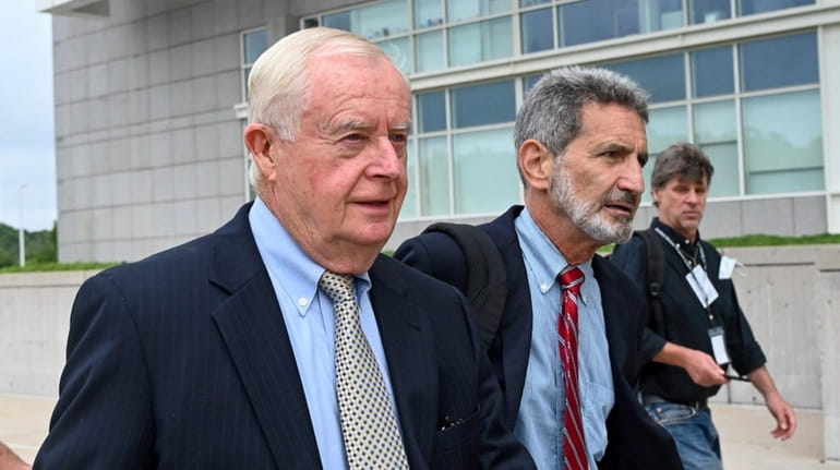 Former Suffolk District Attorney Thomas Spota, left, arrives at federal...