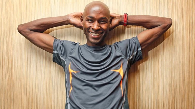 Eight-time Wanamaker mile champion Bernard Lagat poses after a news...