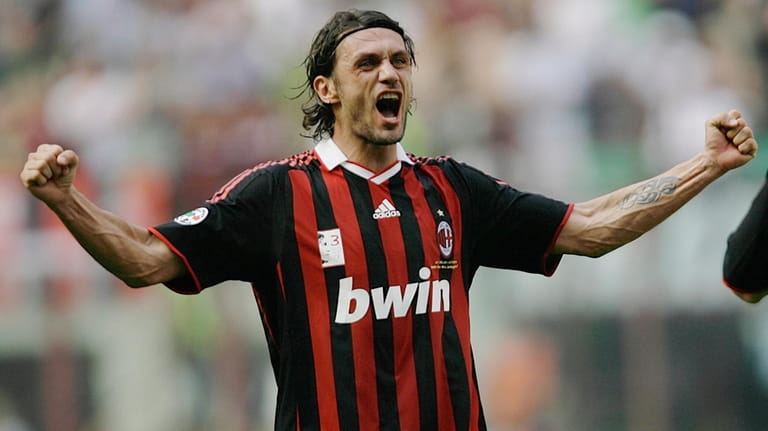 AC Milan defender Paolo Maldini salutes his fans at the...