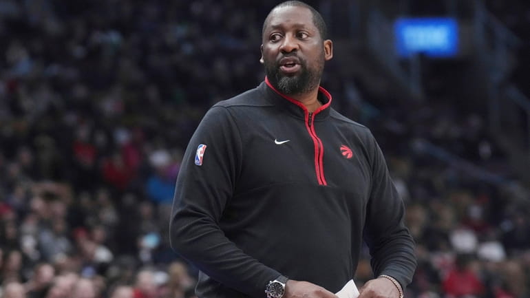 FILE -Toronto Raptors assistant coach Adrian Griffin takes charge of...