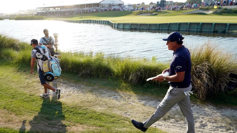 FILE -0 Phil Mickelson walks to the 18th hole during...