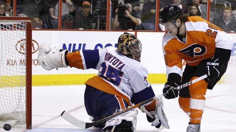 New York Islanders goalie Al Montoya (35) blocks a shot...