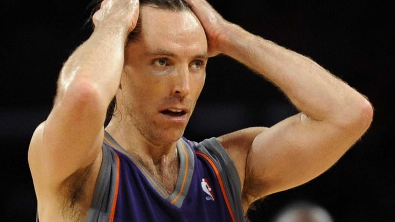 Phoenix Suns guard Steve Nash reacts during the second half...