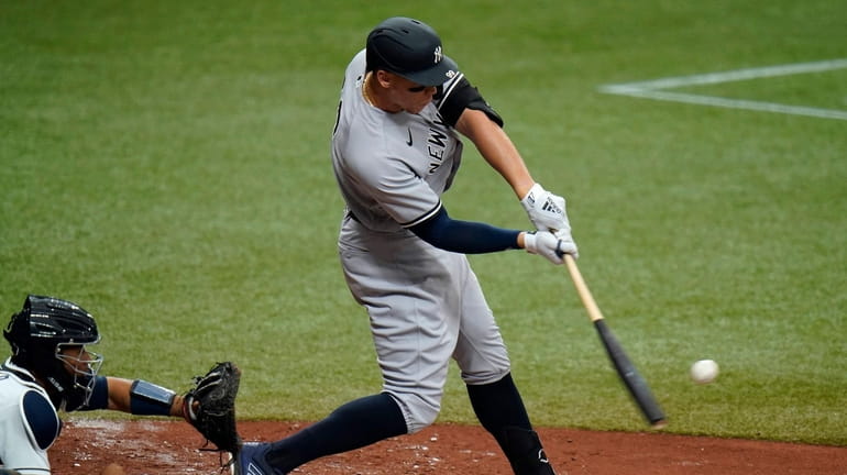 Yankees' Aaron Judge lines a single off Tampa Bay Rays...