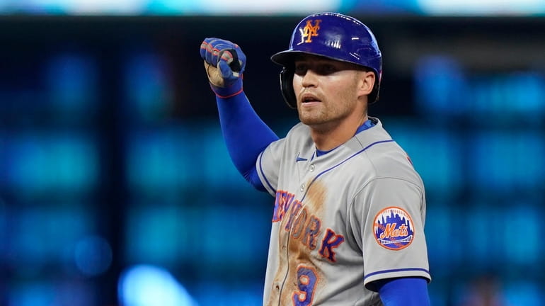 Mets' Brandon Nimmo celebrates after hitting a ground rule double...