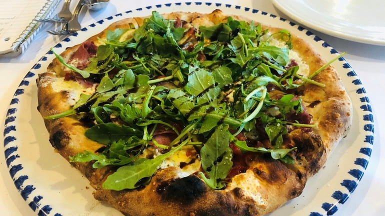 A prosciutto and fig pizza at La Tavola, a new...