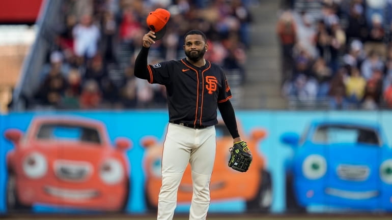 San Francisco Giants third baseman Pablo Sandoval gestures to fans...