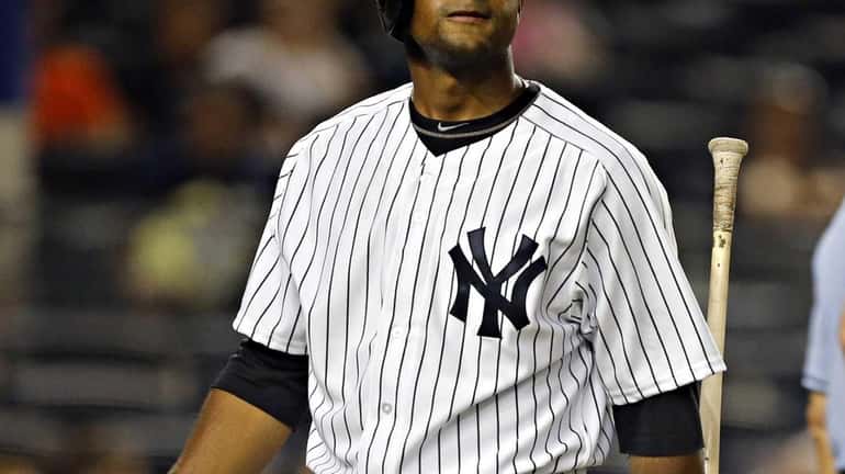Yankees left fielder Zoilo Almonte is dejected after striking out...