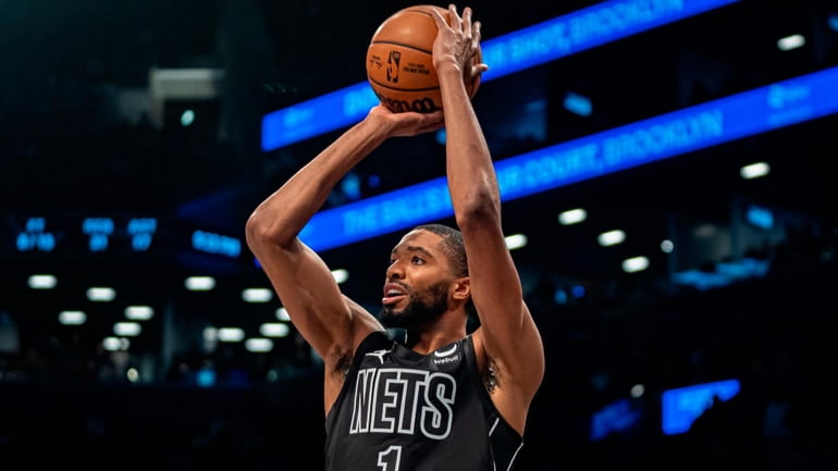 The Nets' Mikal Bridges shoots during the second half of...