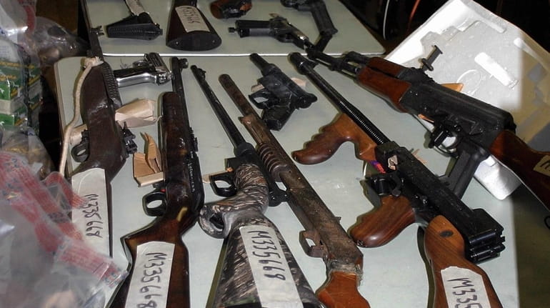 Guns that were seized from a home.