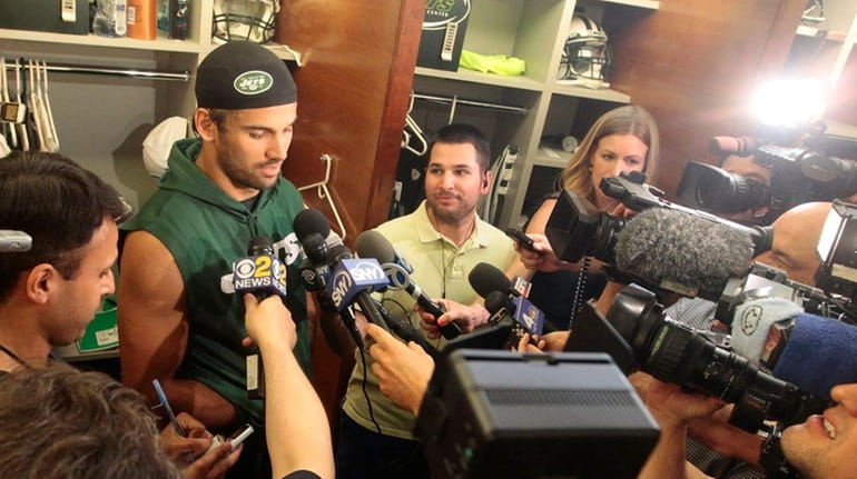 Eric Decker of the Jets addresses the media in the...