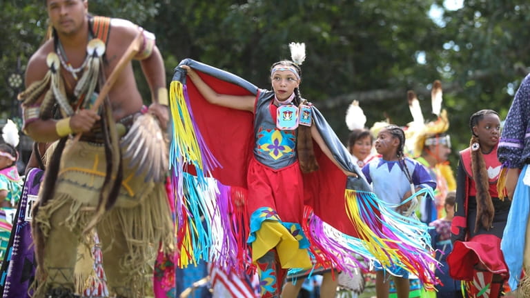 Participants performed Native American dances at the Shinnecock Nation Powwow...