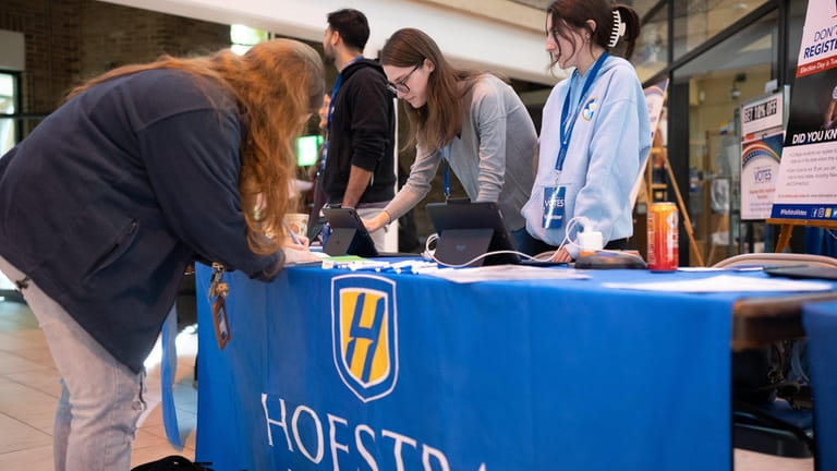 Hofstra freshman Peris Roney registers in her home state of...