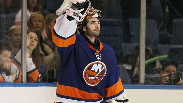 Islanders goaltender Al Montoya celebrates after being named the second...
