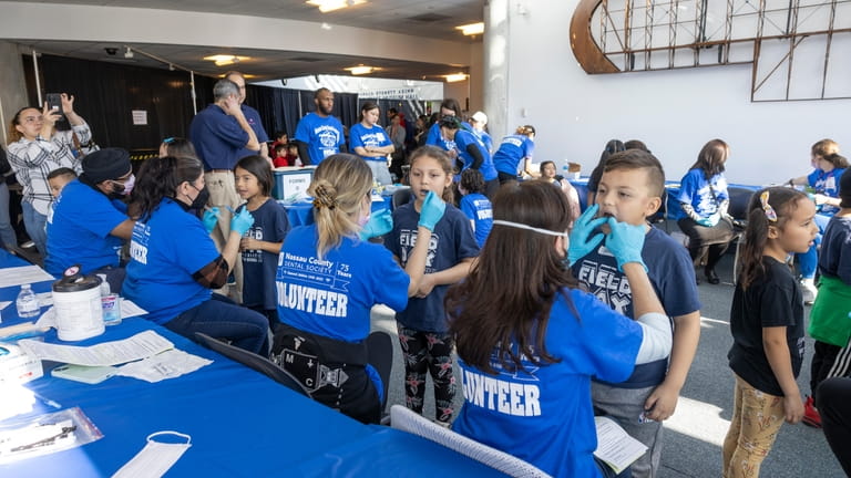 About 1,500 children received dental screenings at an event sponsored...
