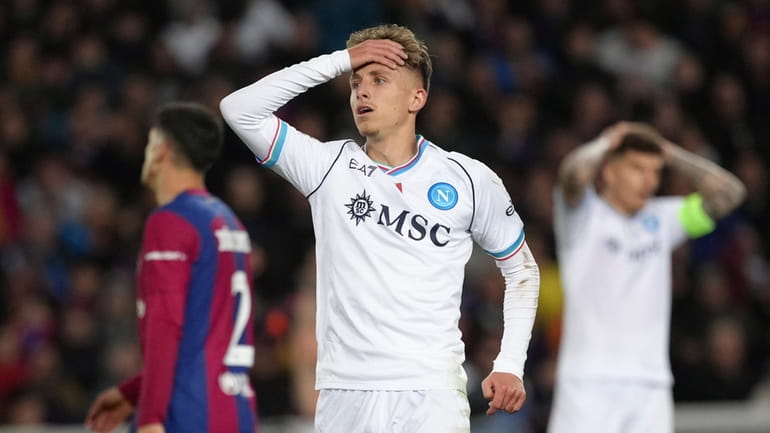 Napoli's Jesper Lindstrom reacts after a missed scoring opportunity during...