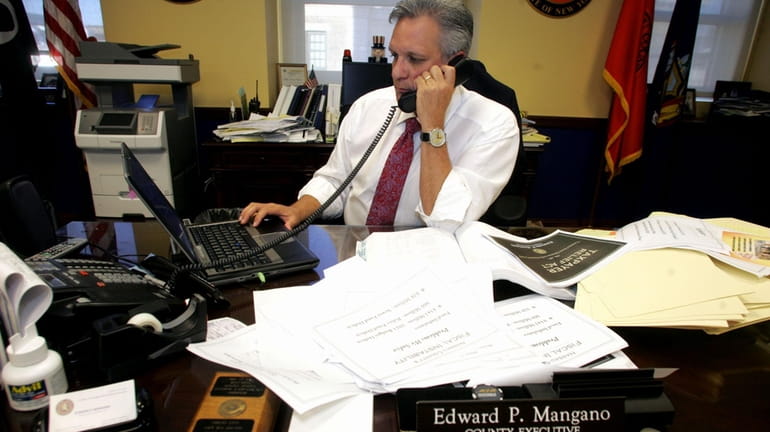 Nassau County Executive Edward Mangano works on the new county...