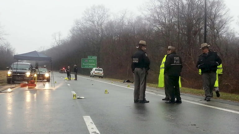 New York State Police investigate a fatal accident involving a...
