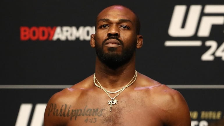 Jon Jones steps on the scale during the UFC 247...