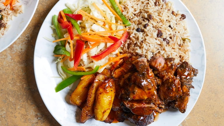 Jerk pork with rice and peas, sweet plantains and cabbage...