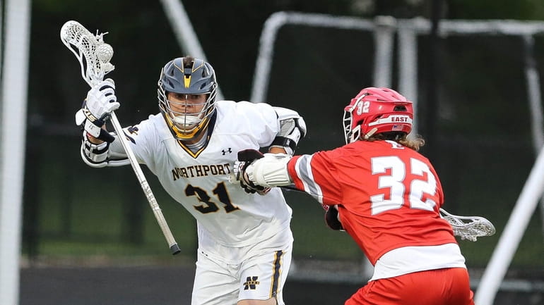 Northport's Timothy Kirchner (31) looks to get around Smithtown East's...