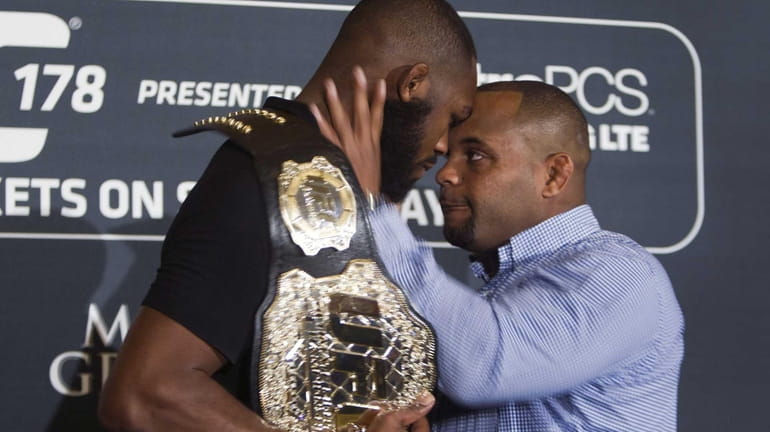 In this Aug. 4, 2014 photo, challenger Daniel Cormier, right,...