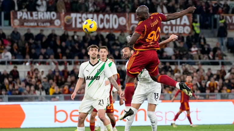 Roma's Romelu Lukaku attempts a header at goal during a...