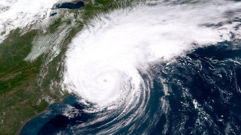 Hurricane Dorian over the Atlantic Ocean makes landfall on North Carolina's...