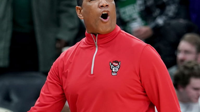 North Carolina State head coach Kevin Keatts calls out to...