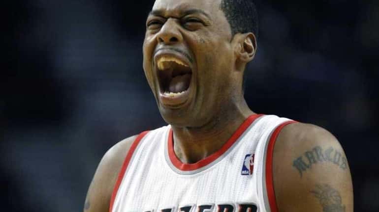 Portland Trail Blazers' Marcus Camby (23) reacts at the start...