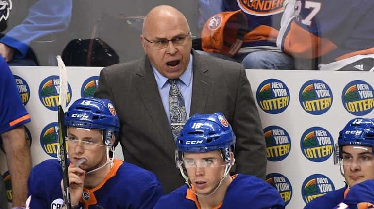 Islanders coach Barry Trotz reacts after the Washington Capitals scored...