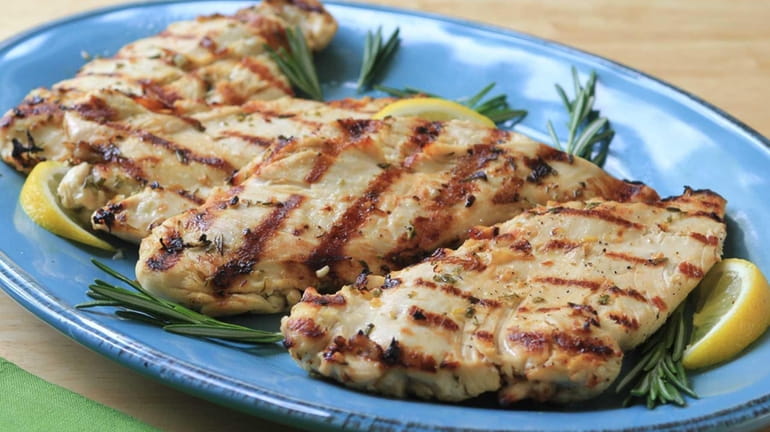 Chicken breasts are pounded and marinated in rosemary, olive oil,...
