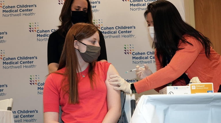 Hanna Riva Goldberg, 16, gets a COVID-19 vaccine Tuesday.