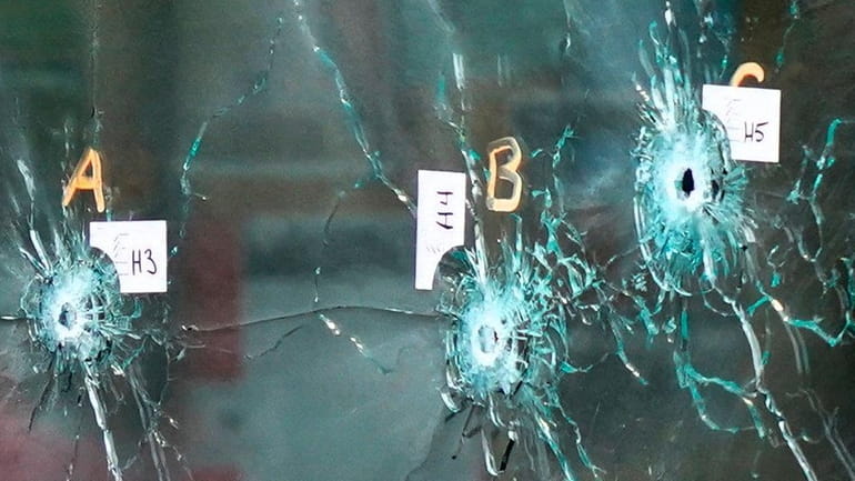Bullet holes in a window at Tops Friendly Market in Buffalo...
