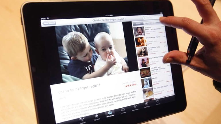 In this file photo, the Apple iPad is examined after...