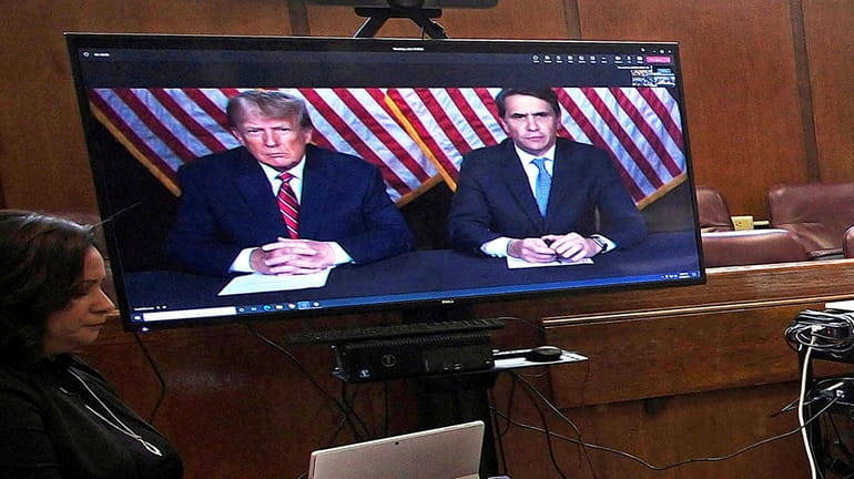 Former president Donald Trump, left on screen, and his attorney,...