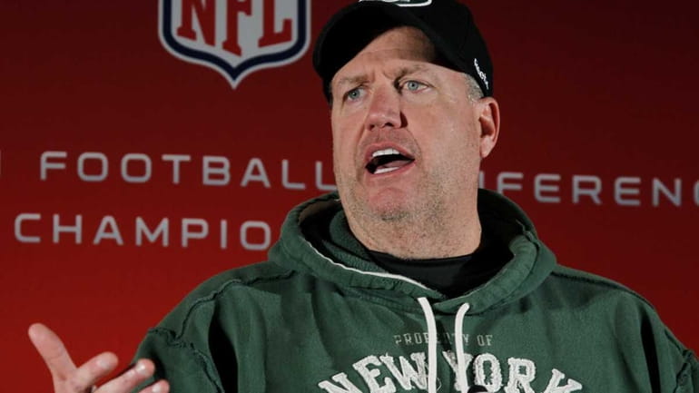 New York Jets head coach Rex Ryan gestures as he...