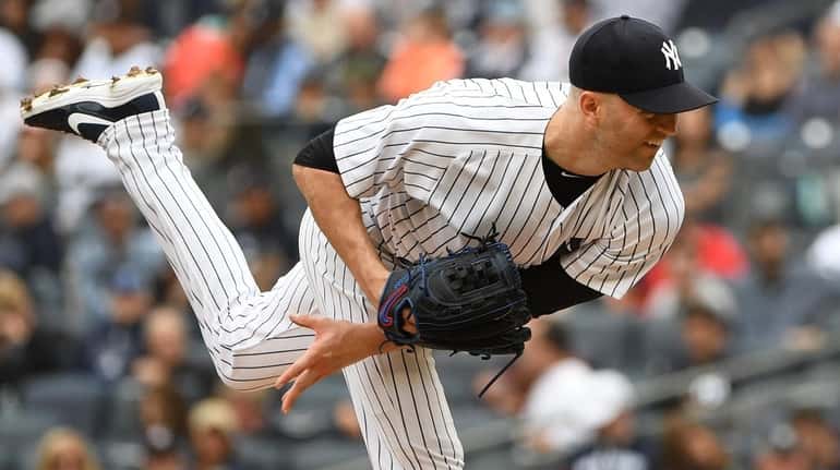 Yankees pitcher J.A. Happ delivers against the Orioles during the...