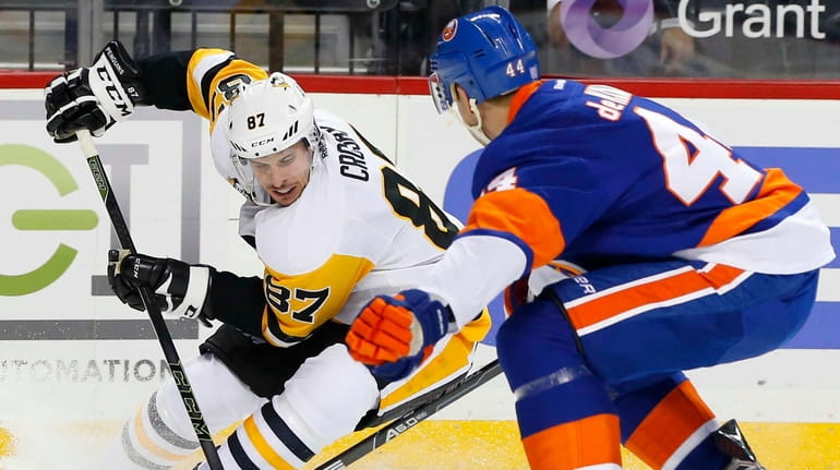 Sidney Crosby #87 of the Pittsburgh Penguins controls the puck...