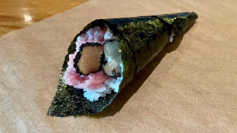 A handroll of toro and black truffle at Ocean Code...