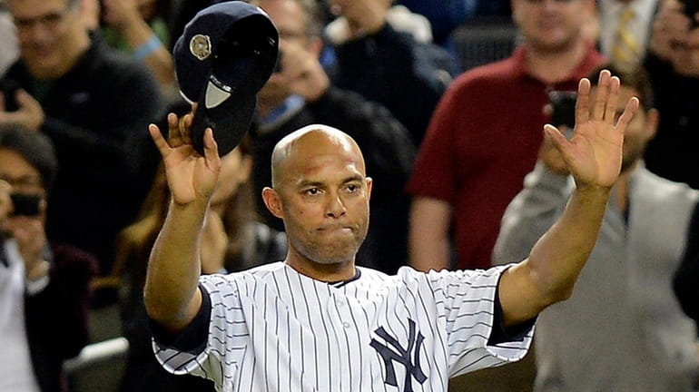 Yankees pitcher Mariano Rivera waves to fans for the last...