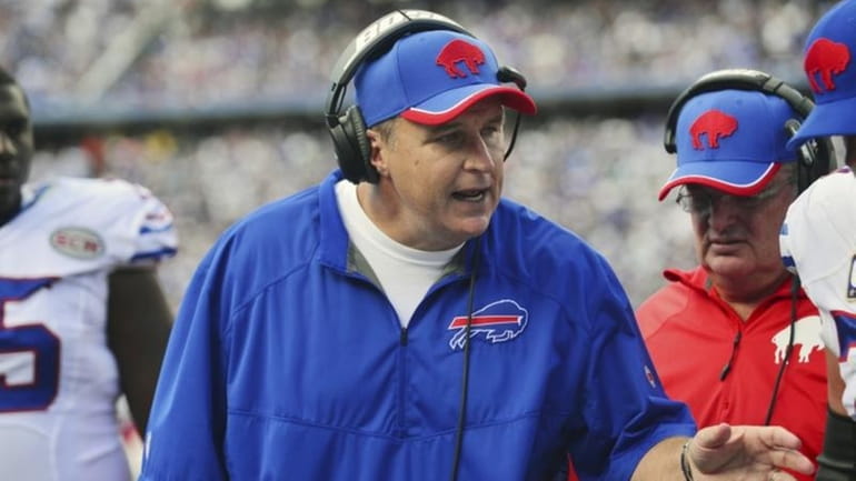 Buffalo Bills head coach Doug Marrone talks to players on...