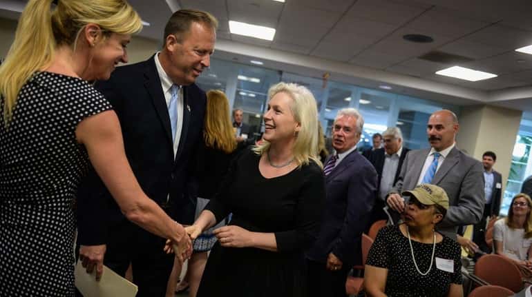 Sen. Kirsten Gillibrand greets people before addressing the Long Island...