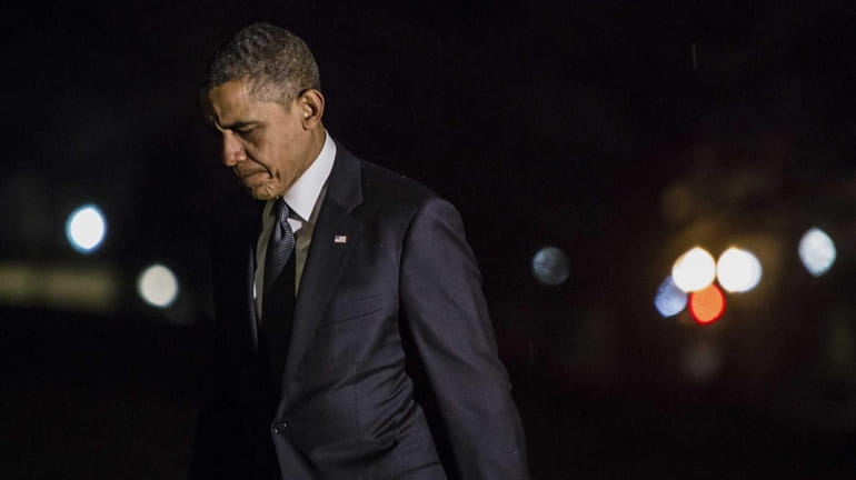 U.S. President Barack Obama returns to the White House after...