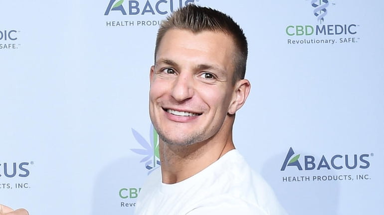 Rob Gronkowski at a press conference announced he is becoming...