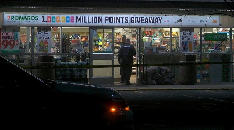 Suffolk County police investigate a robbery early Saturday of a...