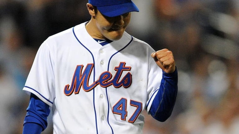 New York Mets relief pitcher Hisanori Takahashi (47) reacts after...