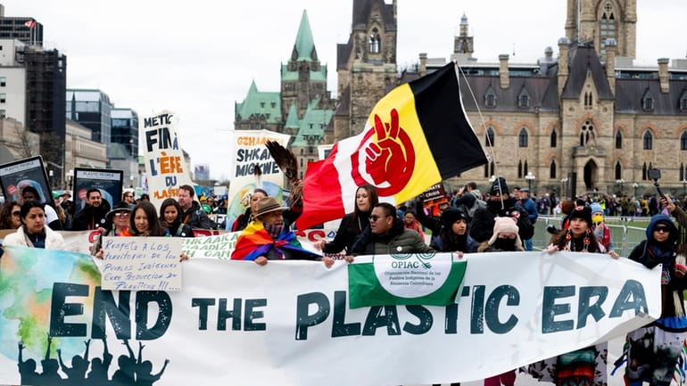 People participate in a March to End the Plastic Era...