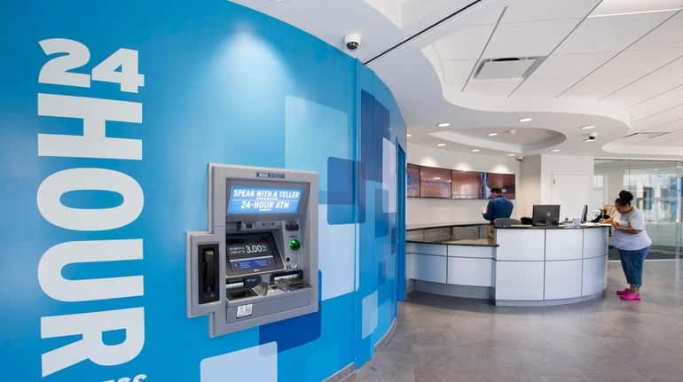The Bay Shore NEFCU branch facility with interactive teller machines,...
